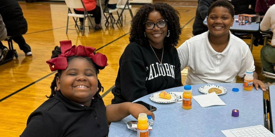 Kids Care Elementary scholars with their mom.